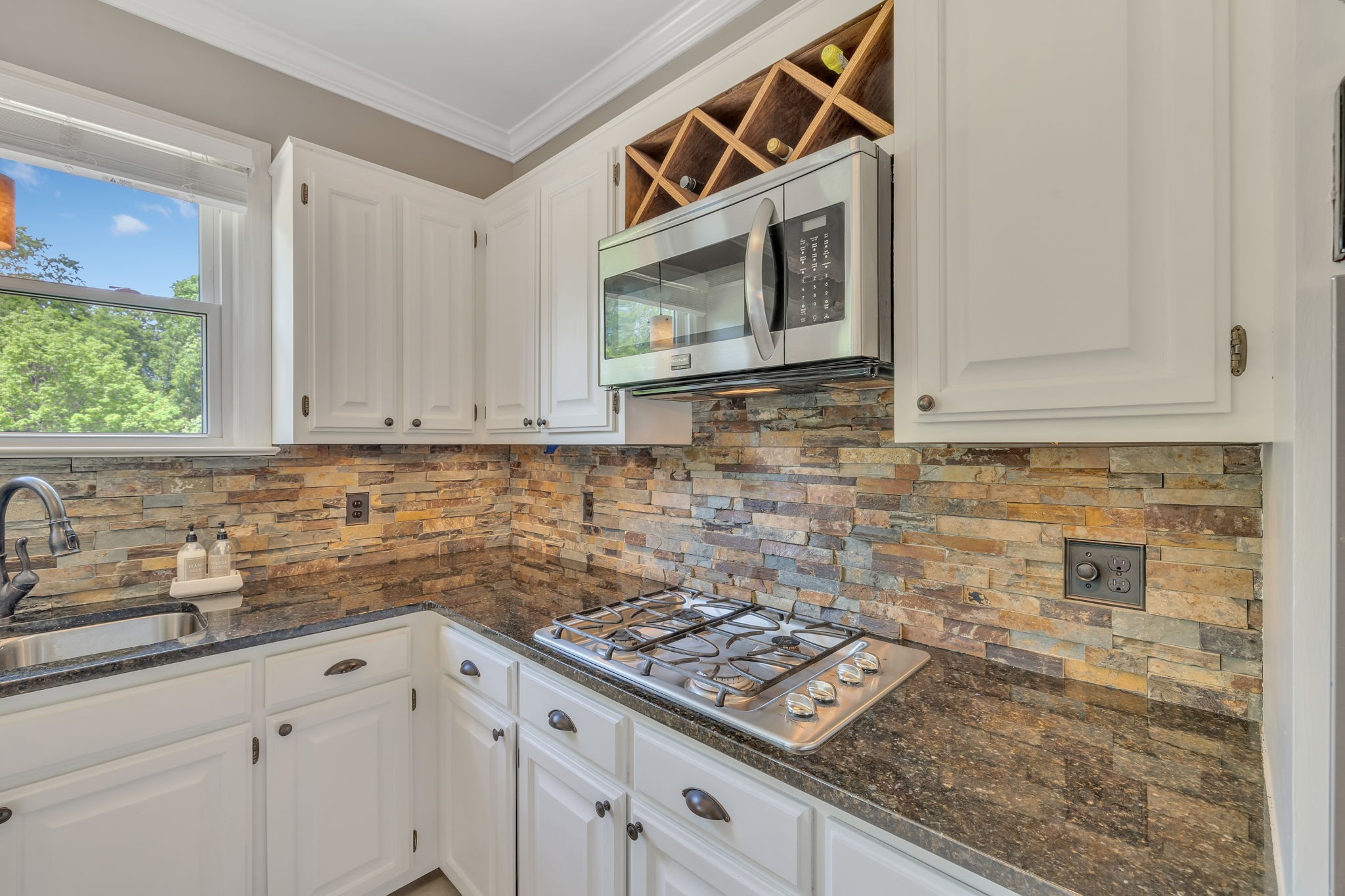 2226 Oakleaf Drive Franklin, TN 37064 - Photo 27 of 70 a kitchen with stainless steel appliances granite countertop a sink stove and microwave