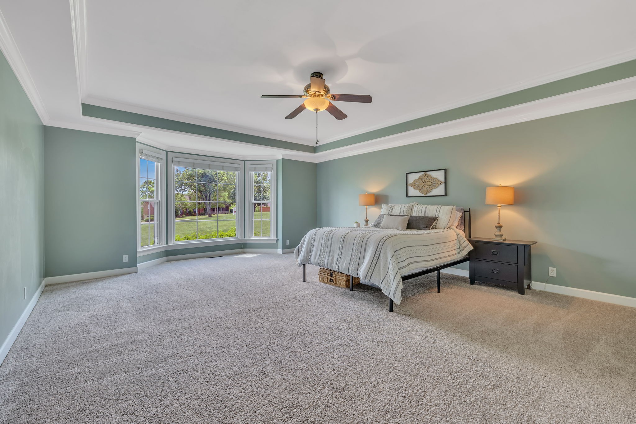 2226 Oakleaf Drive Franklin, TN 37064 - Photo 28 of 70 a spacious bedroom with a bed and a chandelier