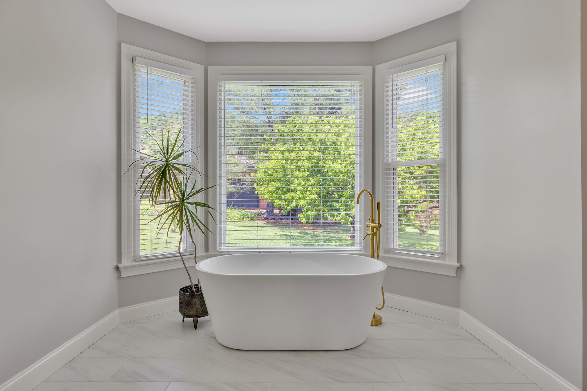 2226 Oakleaf Drive Franklin, TN 37064 - Photo 31 of 70 a white bath tub sitting in a bathroom next to a window
