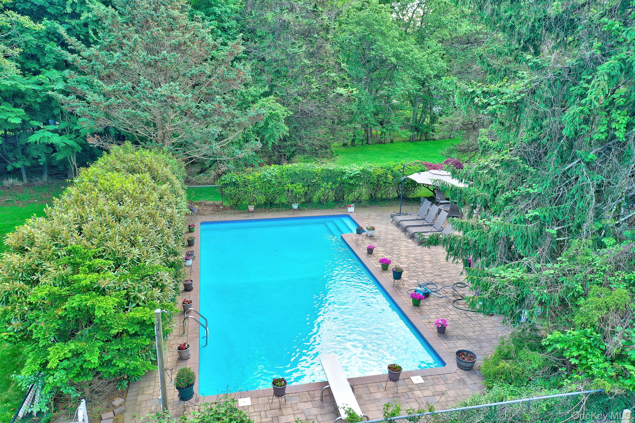 15 Stillwater Road Nissequogue, NY 11780 - Photo 32 of 43 Rectangular inground pool surrounded by paver patio