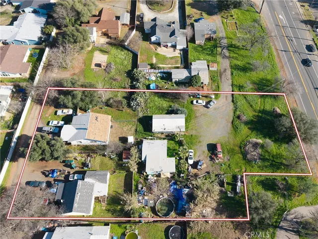 an aerial view of houses with outdoor space