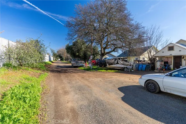 a view of street with parked cars