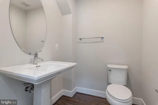 a view of an entryway with wooden floor