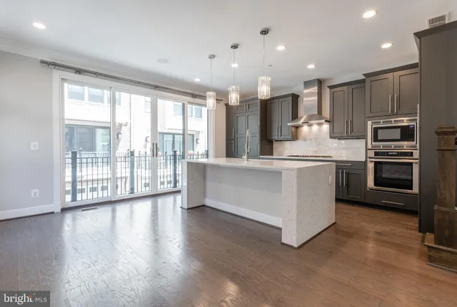 a bathroom with a sink a vanity a mirror and a shower