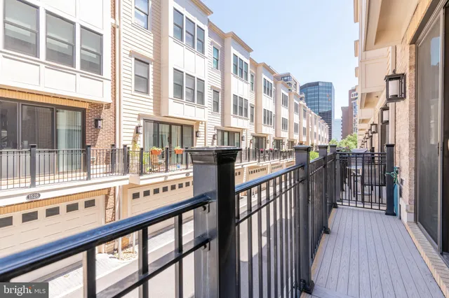 an empty room with wooden floor and closet area