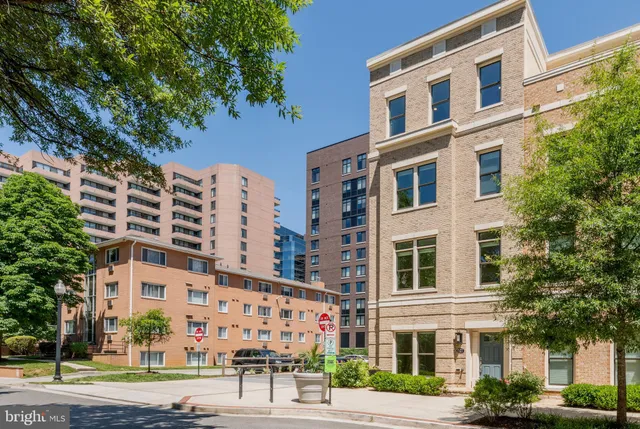 front view of a brick house with a large window
