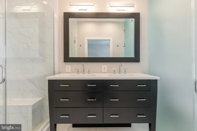 a white toilet sitting next to a bath tub