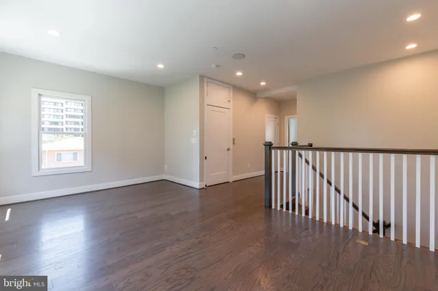 a view of path along with retail shop and buildings