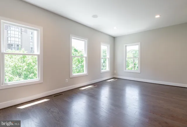 a group of people sitting in front of retail shop