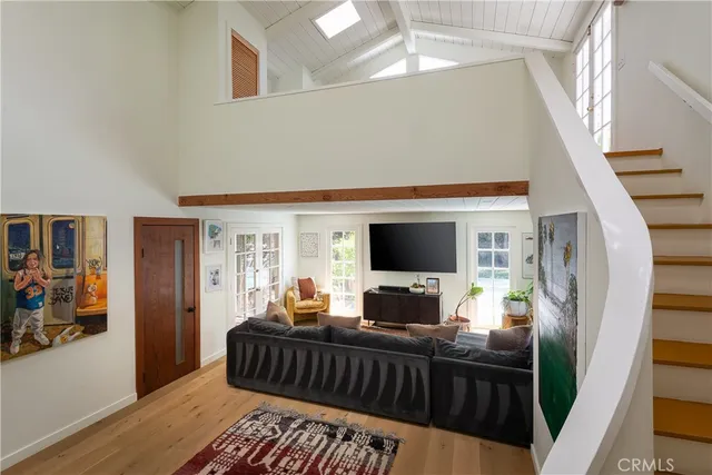 a living room with furniture and a rug