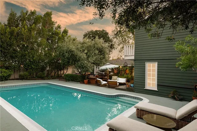 a view of a table and chairs under an umbrella