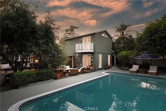 a view of a swimming pool with a yard