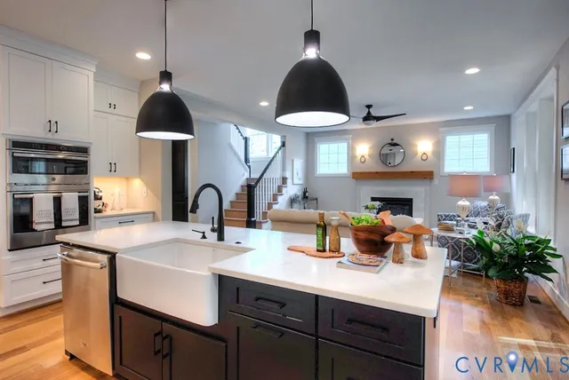a kitchen with white cabinets and appliances