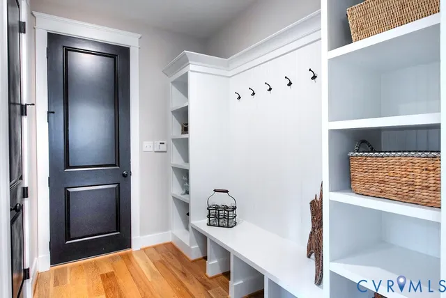 a view of room with furniture and wooden floor