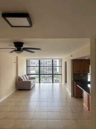 a kitchen with granite countertop a sink and stainless steel appliances