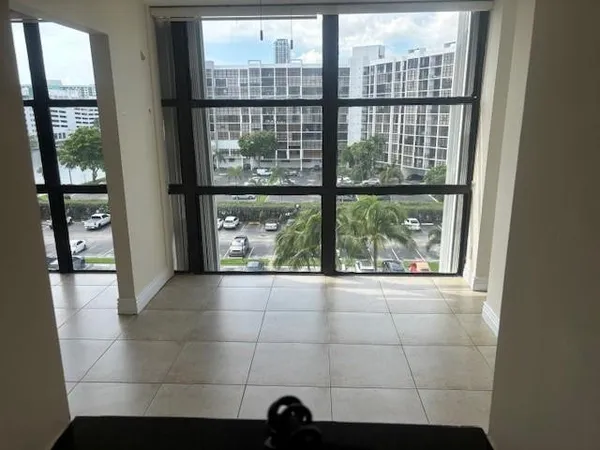 a view of an empty room with a fireplace