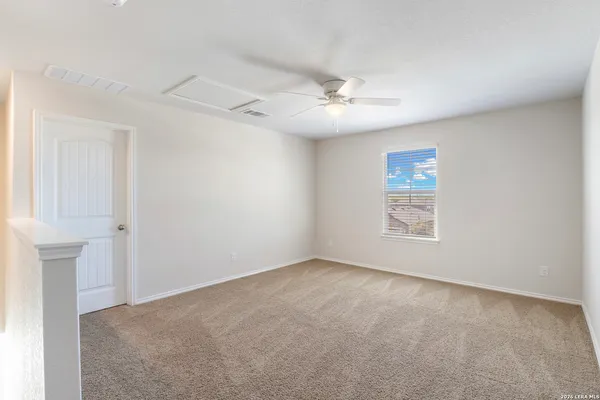 a view of empty room with windows