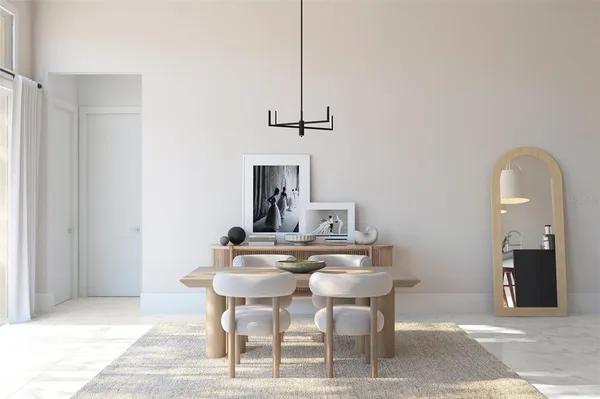 a dining room with a table and chairs