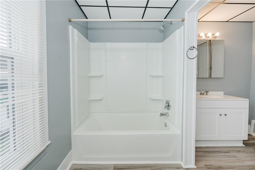 4992 Richmond Road Rochester Mills, PA 15771 - Photo 13 of 34 a bathroom with a bathtub a mirror a vanity and a shower