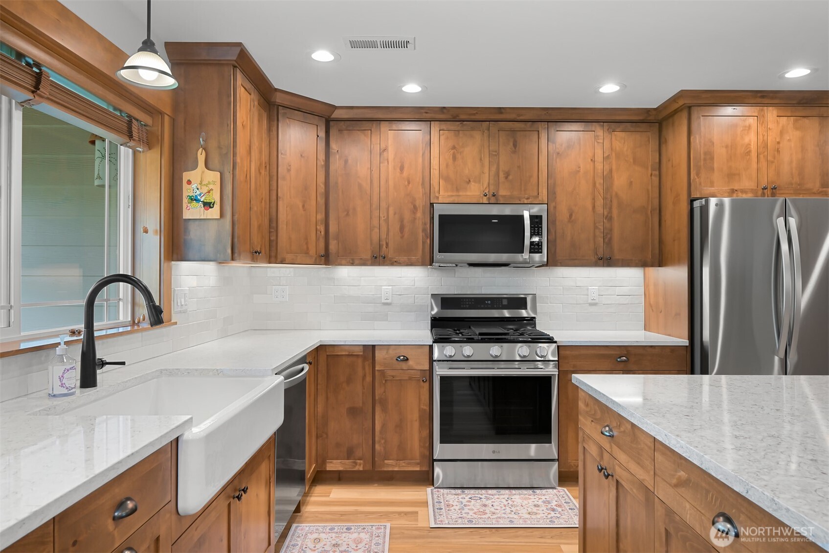 502 Westview Place Nooksack, WA 98276 - Photo 9 of 30 a kitchen with kitchen island stainless steel appliances a stove sink and microwave