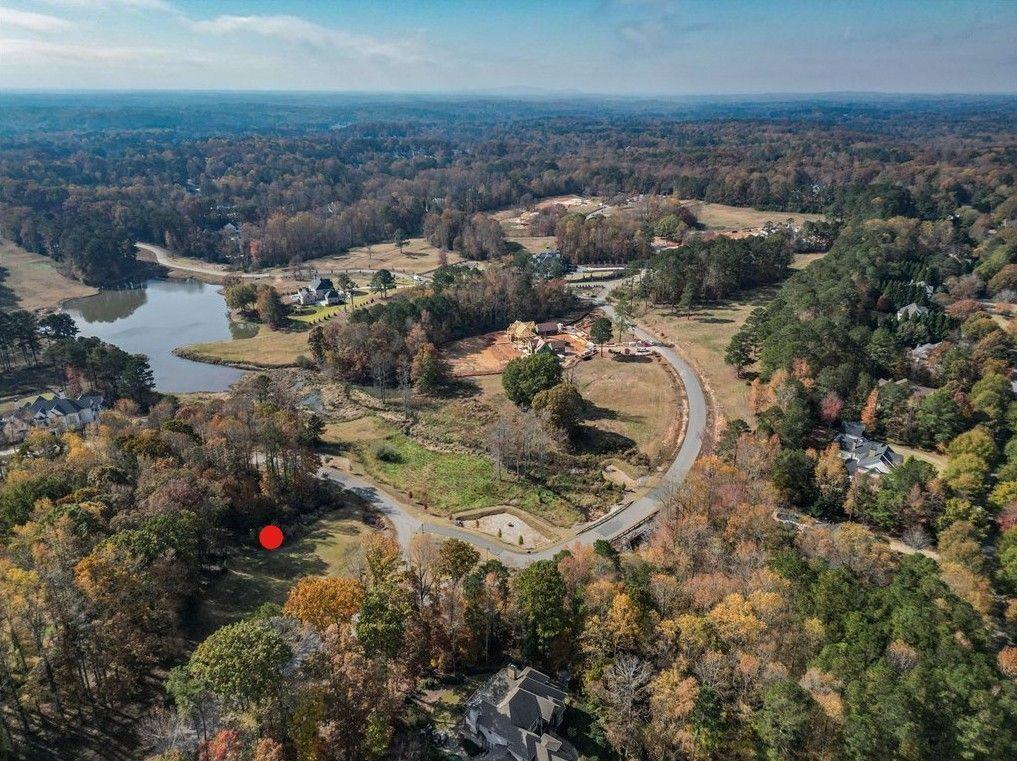 2027 Magnolia Lane Milton, GA 30004 - Photo 12 of 19 an aerial view of residential house and lake