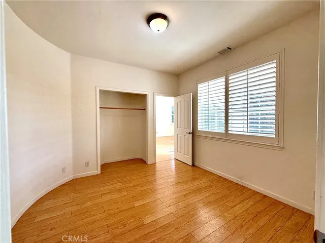 a view of an empty room with windows