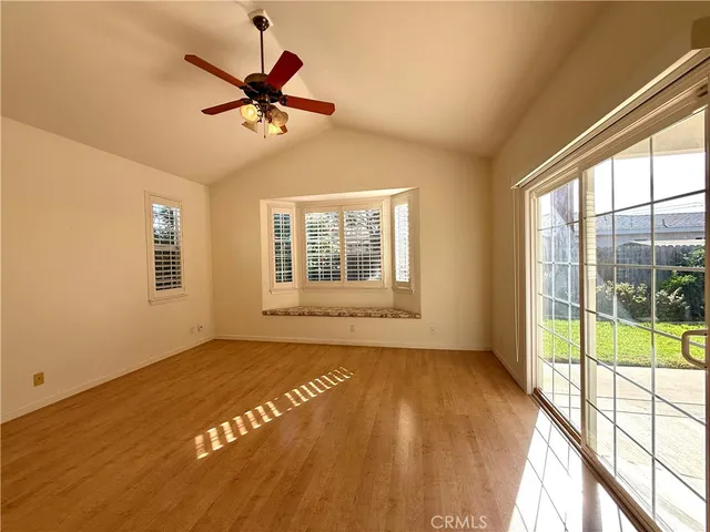 a view of a room with a ceiling fan