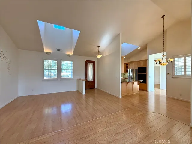 a view of a kitchen with a dining table & chairs