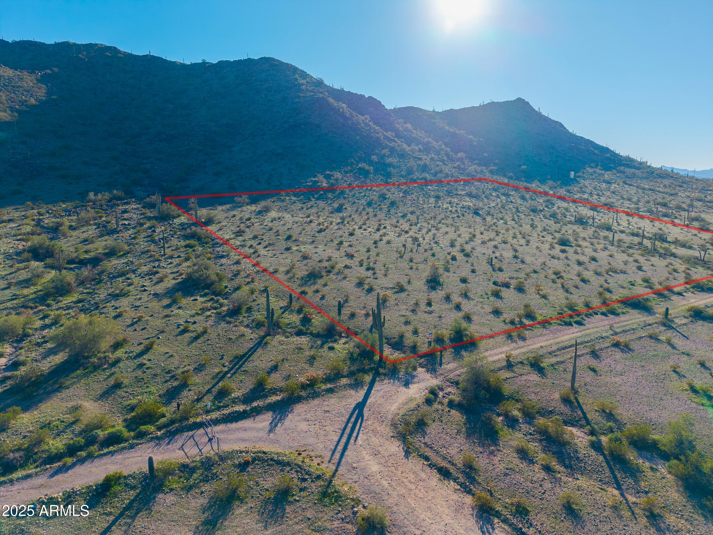 0 West Lantern Road Maricopa, AZ 85139 - Photo 2 of 21 a view of a mountain with a lush green hillside