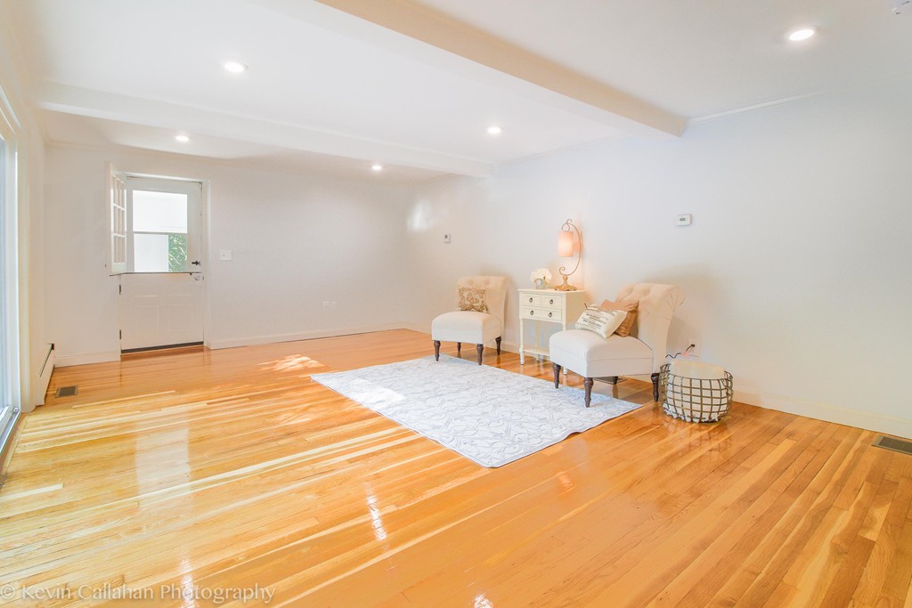 14 Pine Hill Road Framingham, MA 01701 - Photo 11 of 26 a bedroom with a bed and a chandelier