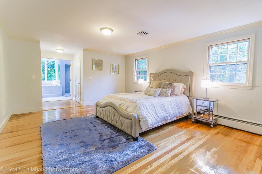 14 Pine Hill Road Framingham, MA 01701 - Photo 16 of 26 a bedroom with a bed and a large window with outer view