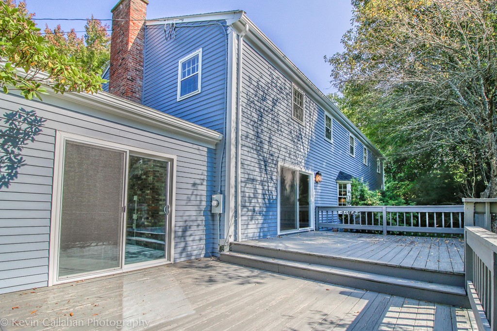 14 Pine Hill Road Framingham, MA 01701 - Photo 25 of 26 a view of a house with a small yard and wooden floor and fence