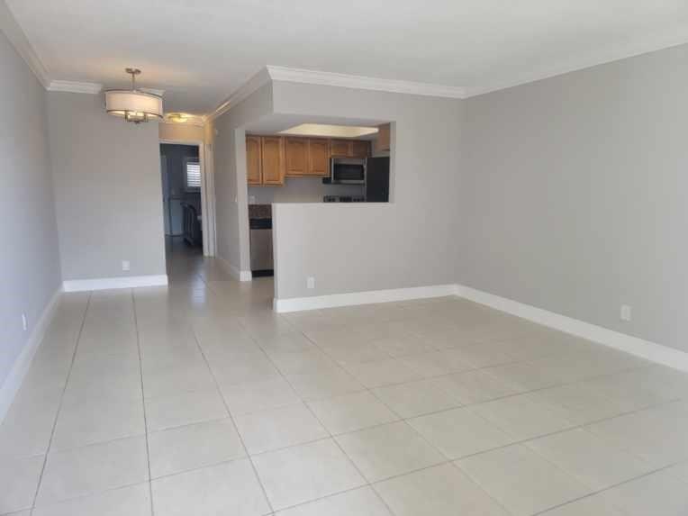 2100 Diana Drive, Unit 107 Hallandale Beach, FL 33009 - Photo 3 of 9 an empty room with a bathroom and a sink