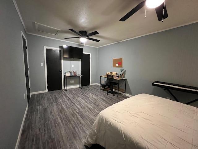 5611 16th Place Lubbock, TX 79416 - Photo 11 of 17 a bedroom with a bed and a chandelier