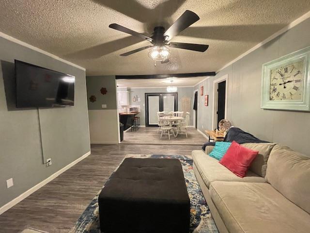 5611 16th Place Lubbock, TX 79416 - Photo 3 of 17 a living room with furniture and a flat screen tv