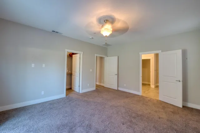 a bedroom with furniture and window
