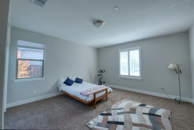 a bedroom with furniture and window