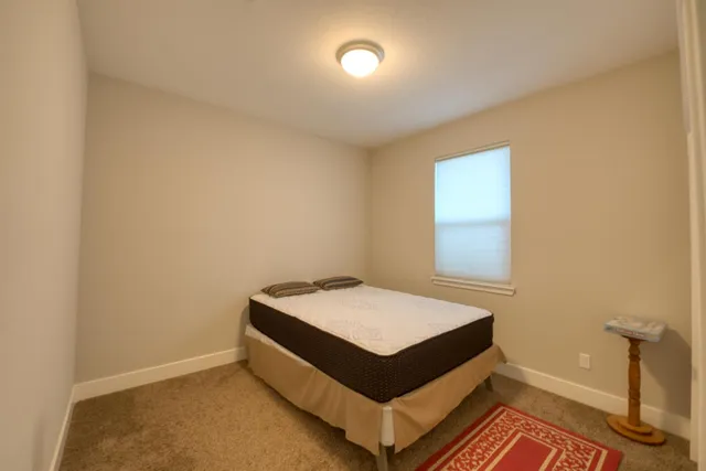 a room with a bed and a window