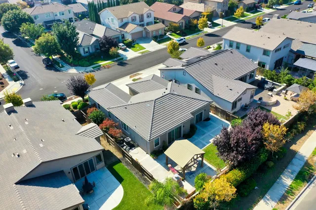 an aerial view of a house with a swimming pool