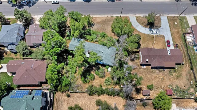 an aerial view of residential houses with outdoor space