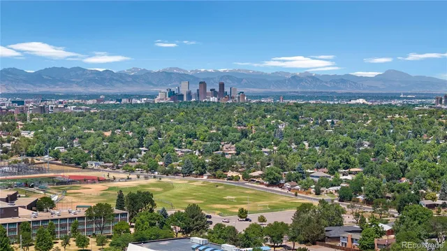 a view of a city with mountains in the background