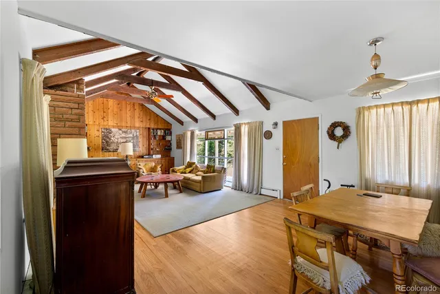 a backyard of a house with a large tree