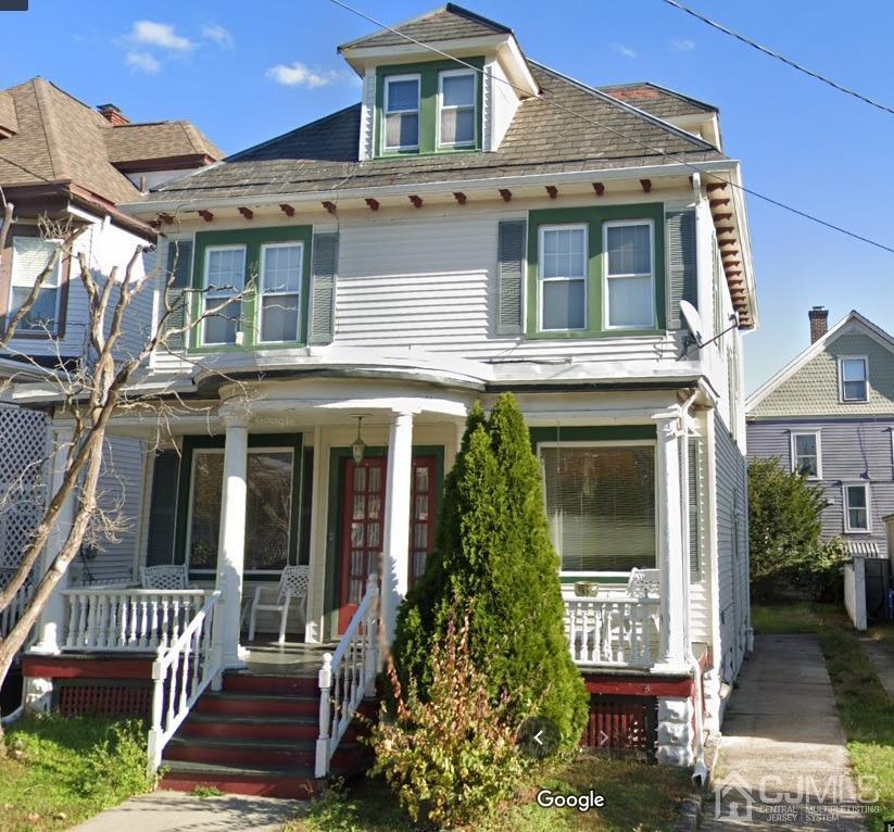 210 Rector Street Perth Amboy, NJ 08861 - Photo 1 of 24 a front view of a house with a garden