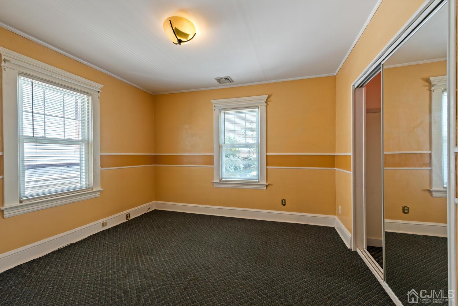 210 Rector Street Perth Amboy, NJ 08861 - Photo 17 of 24 an empty room with a window
