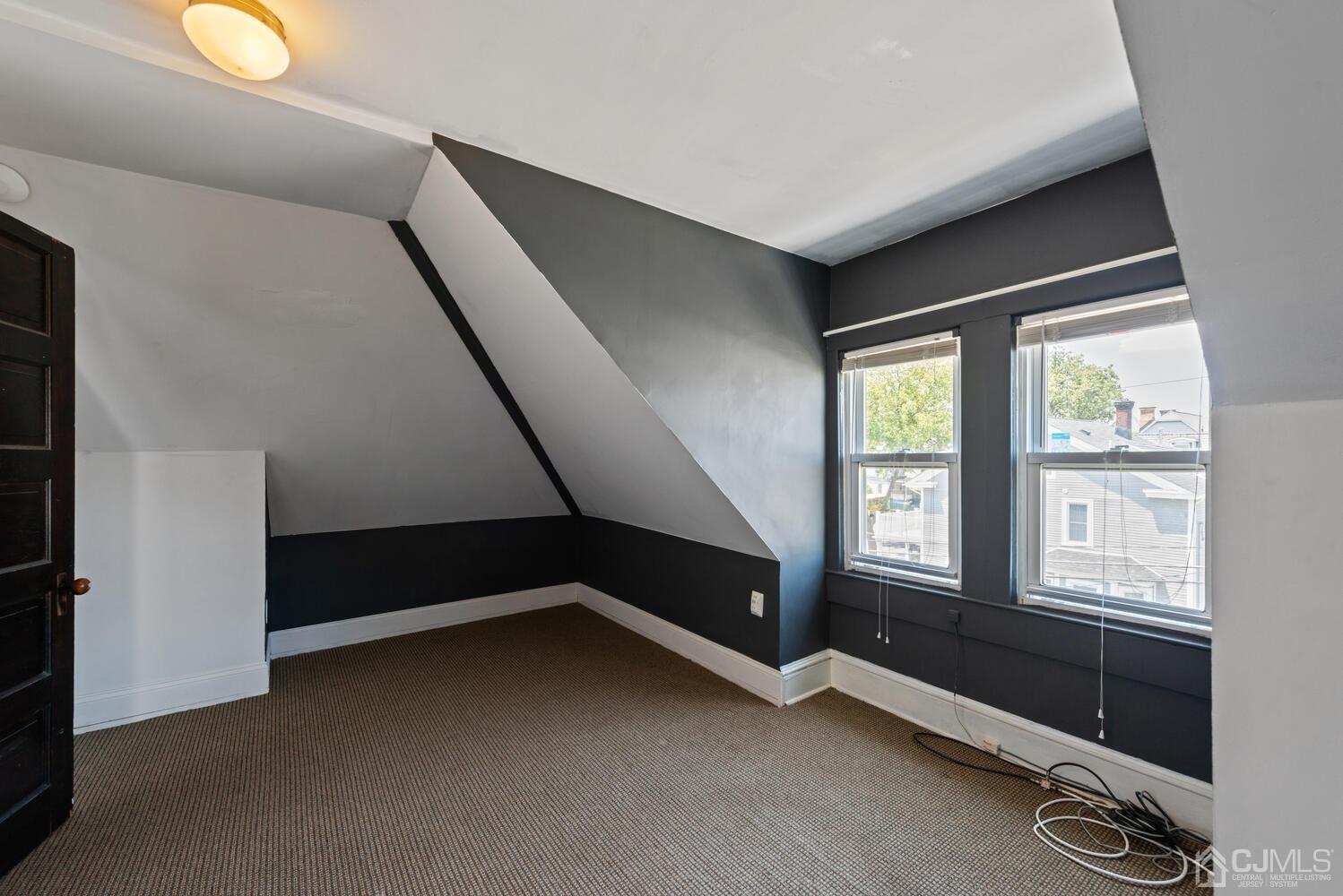 210 Rector Street Perth Amboy, NJ 08861 - Photo 18 of 24 a view of an empty room with a window