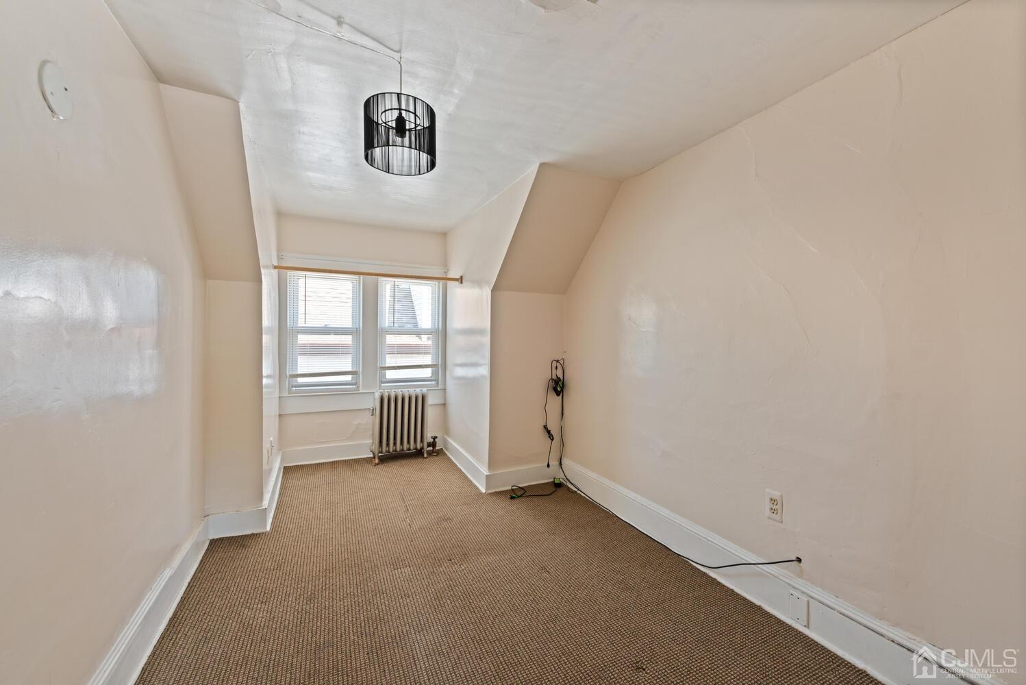 210 Rector Street Perth Amboy, NJ 08861 - Photo 19 of 24 a view of a livingroom with an empty space