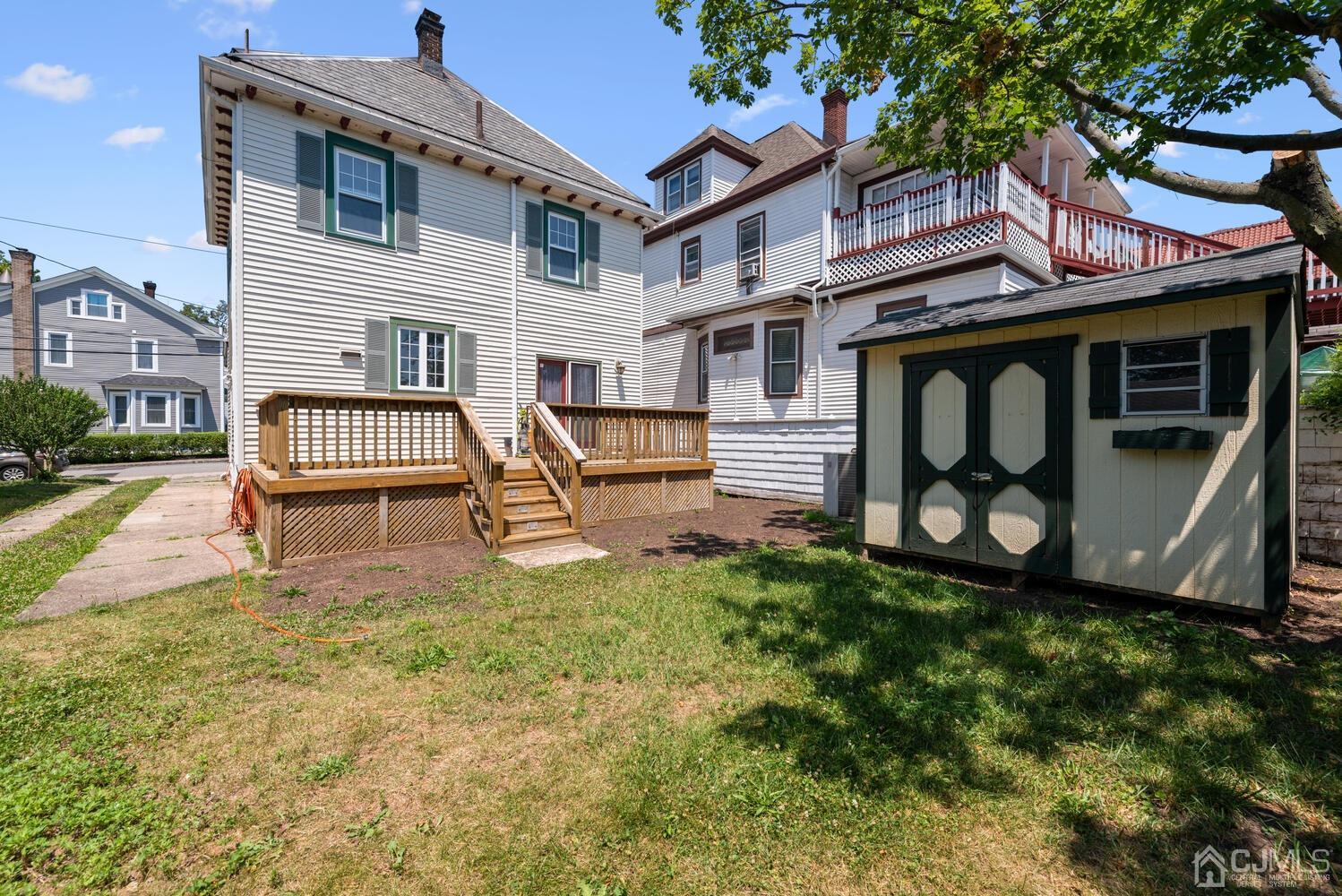 210 Rector Street Perth Amboy, NJ 08861 - Photo 23 of 24 a front view of a house with garden