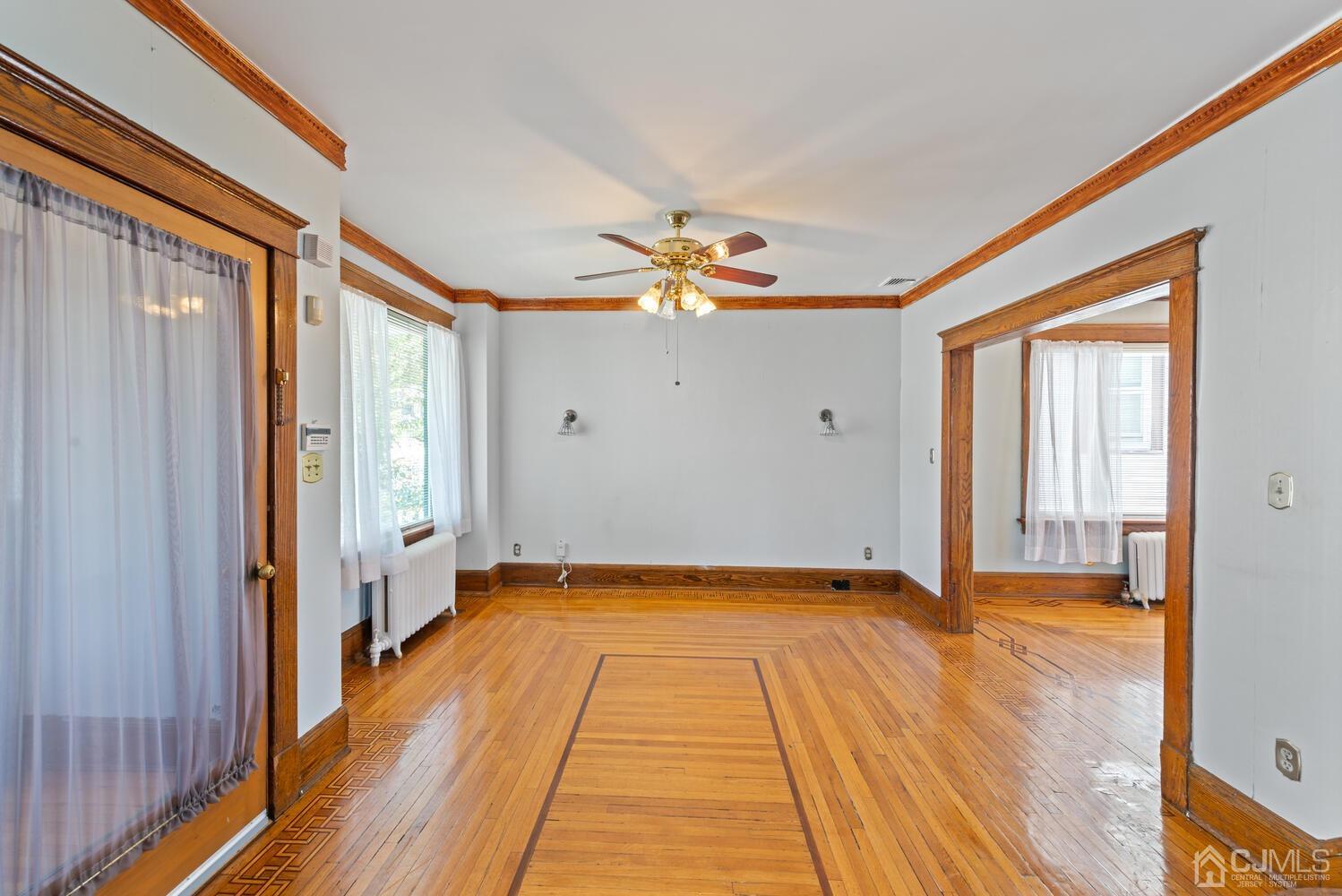 210 Rector Street Perth Amboy, NJ 08861 - Photo 5 of 24 a view of an empty room and glass door