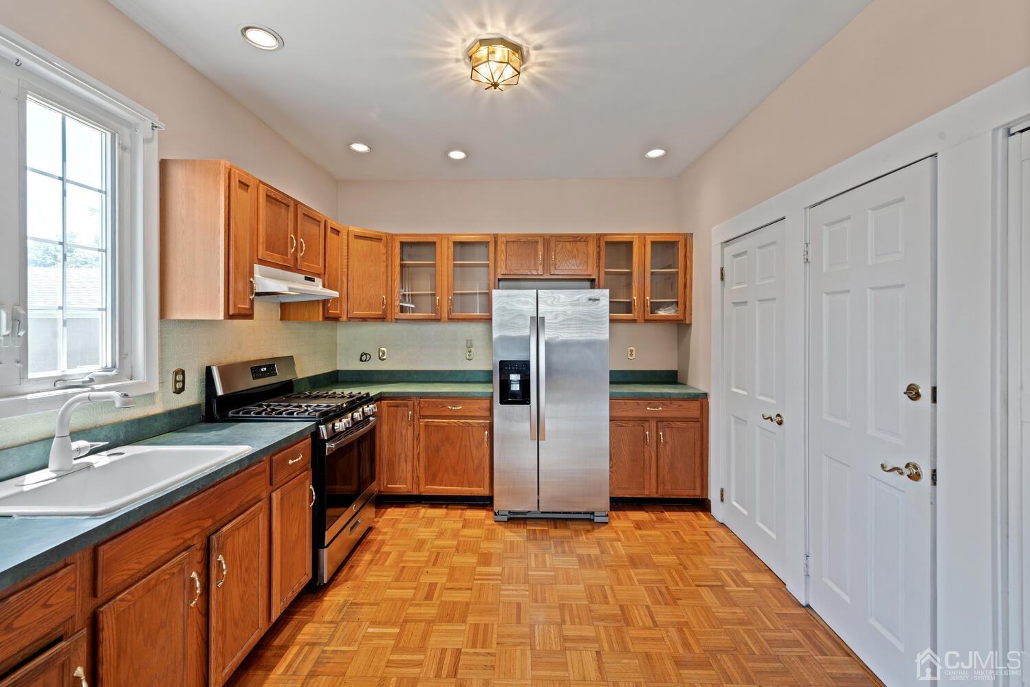 210 Rector Street Perth Amboy, NJ 08861 - Photo 8 of 24 a kitchen with stainless steel appliances granite countertop a refrigerator and a sink
