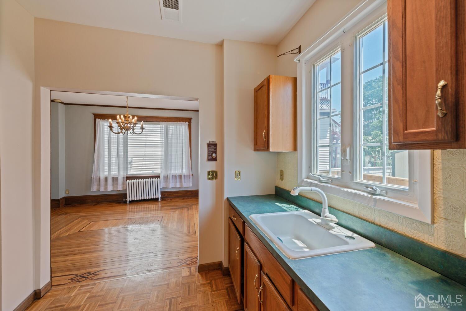 210 Rector Street Perth Amboy, NJ 08861 - Photo 10 of 24 a bathroom with a granite countertop sink and a vanity
